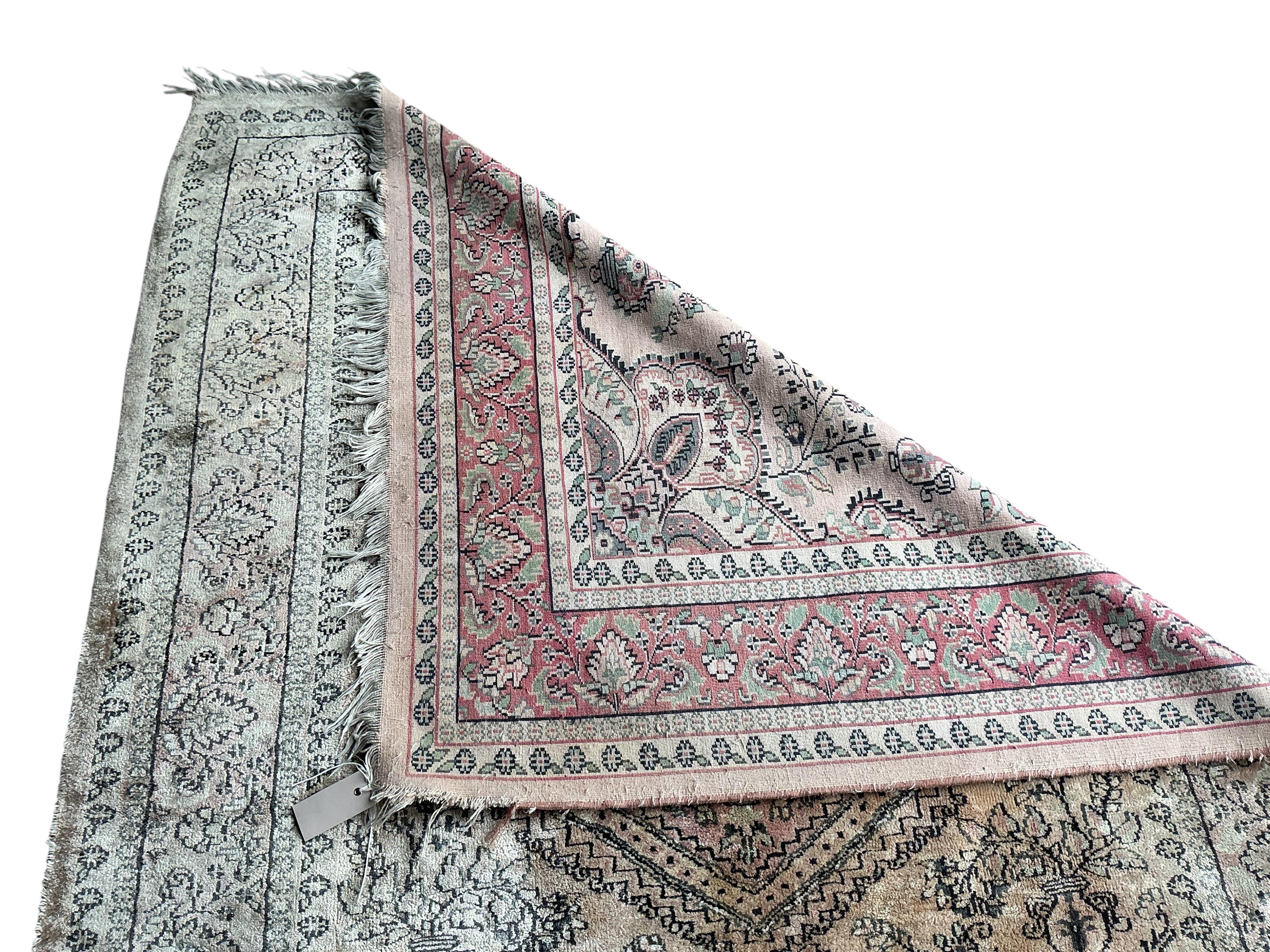 A North West Persian peach ground part silk rug and a Caucasian style rug, larger 175 x 126cm